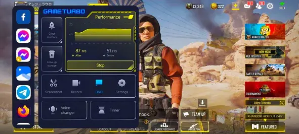 A imagem mostra a interface do "Game Turbo" ativada sobre a tela de um jogo de tiro em primeira pessoa rodando em um smartphone. Ao fundo, visualiza-se um personagem do jogo pronto para combate. A janela do Game Turbo apresenta um gráfico de "Performance" com informações de FPS (frames por segundo) antes e depois da otimização, indicando 87 FPS após e 51 FPS antes. Há também botões para "Clear memory", "Free up storage", além de atalhos para "Screenshot", "Record", "DND", "Settings", "Voice changer" e "Timer". Uma barra lateral à esquerda exibe ícones de aplicativos como Facebook, Messenger, uma loja de aplicativos, galeria de fotos e Telegram. A interface do jogo ao fundo mostra opções de modos como "Ranked Match", "Multiplayer" e "Battle Royale", além de informações de pontuação e moeda virtual no topo da tela.